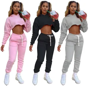 Detail view of the cropped hoodie and sweatpants sets in pink, black, and gray colors