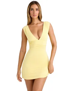 Close-up of yellow deep V-neck sleeveless bodycon dress with ruched waist detail