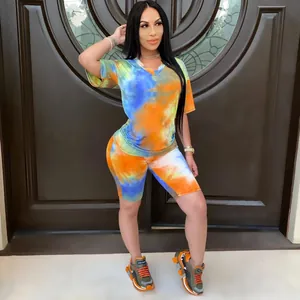 Detailed view of trendy women's tie-dye V-neck top and biker shorts two-piece casual set