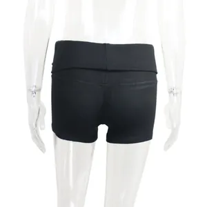 Detail view of black ribbed yoga shorts with fold-over waistband on mannequin.