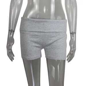 Detail view of women's grey ribbed yoga fitness shorts with a folded high waistband.