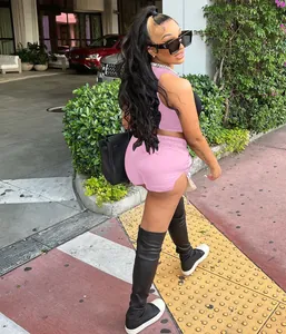 Detailed view of pink two-piece summer set featuring trendy side-slit shorts and a tank top