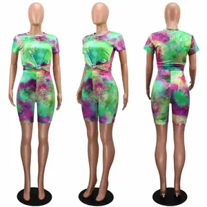 Women's vibrant tie-dye 2-piece set featuring short-sleeve top and athletic shorts
