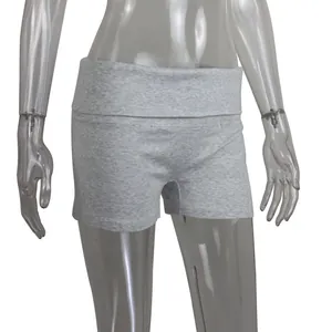 Close-up of grey ribbed yoga shorts with a stylish fold-over high waistband design