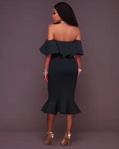 Elegant black off-the-shoulder ruffle dress with fishtail hem shown from the back