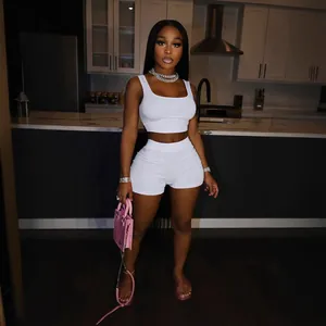 Stylish white two-piece crop top and shorts leisure set for women in kitchen setting