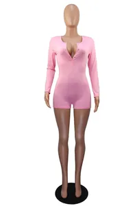 Detail shot of a sexy pink V-neck long sleeve button-up romper loungewear on a mannequin