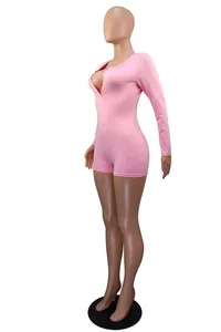Side view of sexy pink V-neck buttoned long sleeve slim fit romper for women