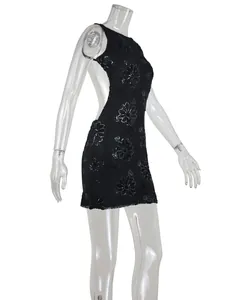 Detailed side view of a black lace sequin mini dress with backless design.