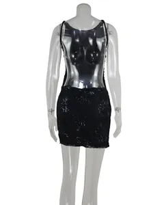 Detailed back view of a black lace sequin mini dress with an elegant backless design for parties