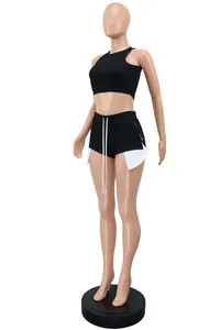Two-piece summer set with sleeveless crop top and white side-slit shorts on mannequin