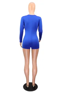 Back view of a royal blue long-sleeve shorts jumpsuit on a white background mannequin