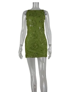 Detail view of green lace mini dress featuring shimmering floral sequin embroidery