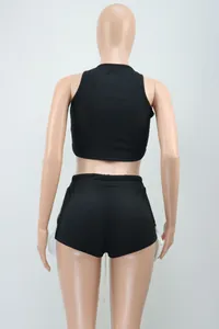 Back view of black sleeveless ribbed crop top and side slit shorts set on mannequin