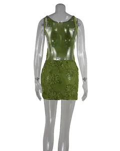 Close-up of green lace sequined party dress featuring an elegant backless design