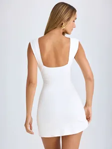 Back view of elegant white sleeveless backless pleated bodycon dress for women