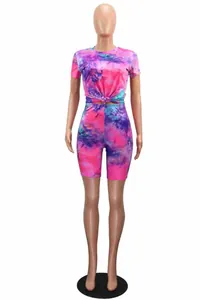 Full front view of vibrant pink and blue tie-dye athletic two-piece set on mannequin