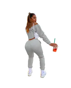 A stylish grey two-piece set featuring an off-the-shoulder sweatshirt and matching joggers