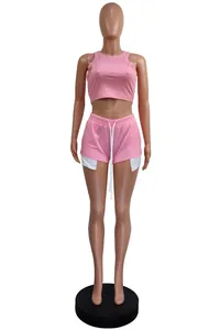 Detail view of pink sleeveless ribbed crop top and matching drawstring shorts set