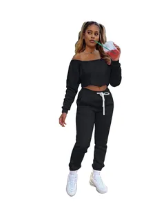 Detailed view of women's black off-the-shoulder sweatshirt and jogger pants set