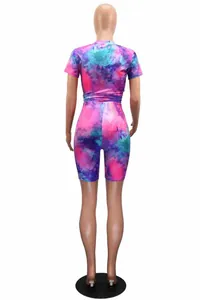 Back view of colorful tie-dye short sleeve and shorts two-piece sports set on mannequin