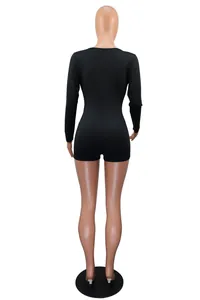 Back view of a black long-sleeved bodycon romper showing the fit and material details