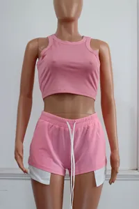 Detail view of pink ribbed sleeveless crop top and matching drawstring shorts set.