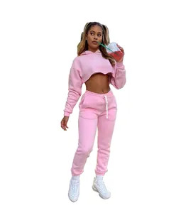 Full-body view of women's pink cropped hoodie and matching joggers sweatpants set