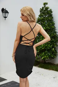 Detailed back view of a black ruched bodycon dress with criss-cross lace-up straps.
