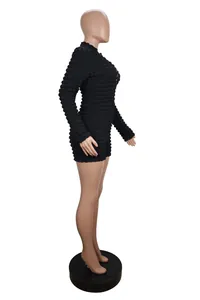 Detailed side view of women's black long sleeve slim fit bodysuit with 3D bubble popcorn texture