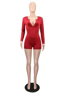 Detailed view of a sexy red V-neck romper featuring button closure and slim fit design