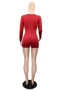 Detail rear view of a long sleeve red solid color romper displayed on a professional mannequin