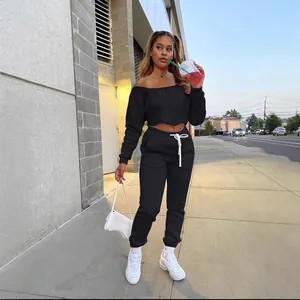 Stylish black off-shoulder two-piece sweatshirt and jogger set for autumn fashion.