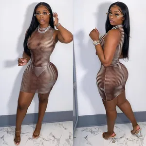 Detailed view of sexy mesh striped bodycon mini dress featuring hollow-out lace design.