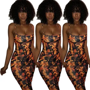 Detail showing the orange camouflage pattern and bodycon fit on a model wearing the dress