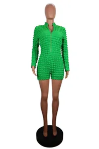 Green long sleeve romper featuring bubble texture knit and a functional V-neck zipper front
