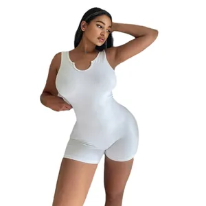 Detailed view of a white ribbed knitted sleeveless bodycon romper featuring a U-neckline