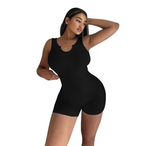 Close-up of black ribbed knit U-neck sleeveless slim fit romper on model.