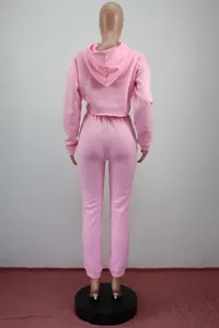 Back view of pink two-piece fleece tracksuit with hooded crop top and joggers set