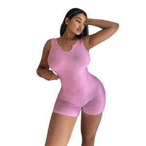 Detailed view of a slim-fit pink ribbed knit sleeveless romper jumpsuit on a model