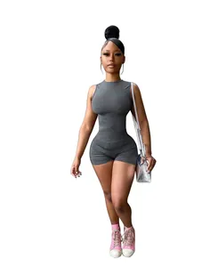 Sexy sleeveless slim-fit romper shorts in dark gray, styled with a silver crossbody bag