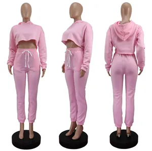 Detailed view of pink two-piece fleece tracksuit from front, side, and back angles