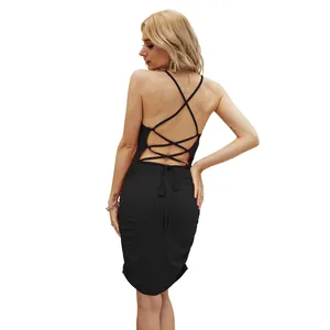 Detailed back view of a black bodycon dress featuring a strappy lace-up design