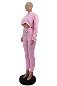 Side view of pink two-piece cropped hoodie and jogger pants set for women
