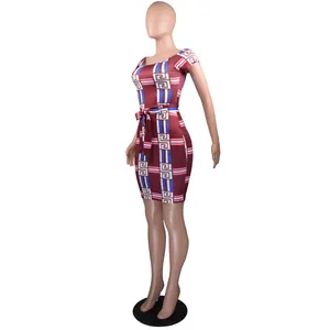 Detailed view of women's off-shoulder dress with geometric Greek key print in maroon