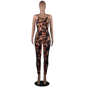 Detail of sexy orange and black camouflage backless one-piece jumpsuit on mannequin