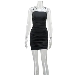 Front view of a sleek black ruched bodycon mini dress displayed on a clear mannequin
