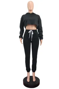 Two-piece black fleece hooded crop top and high-waisted sweatpants set on mannequin
