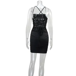 Detailed back view of a black bodycon mini dress featuring criss-cross lace-up straps