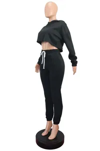 Black two-piece women's fleece tracksuit with cropped hoodie and joggers for casual sports.